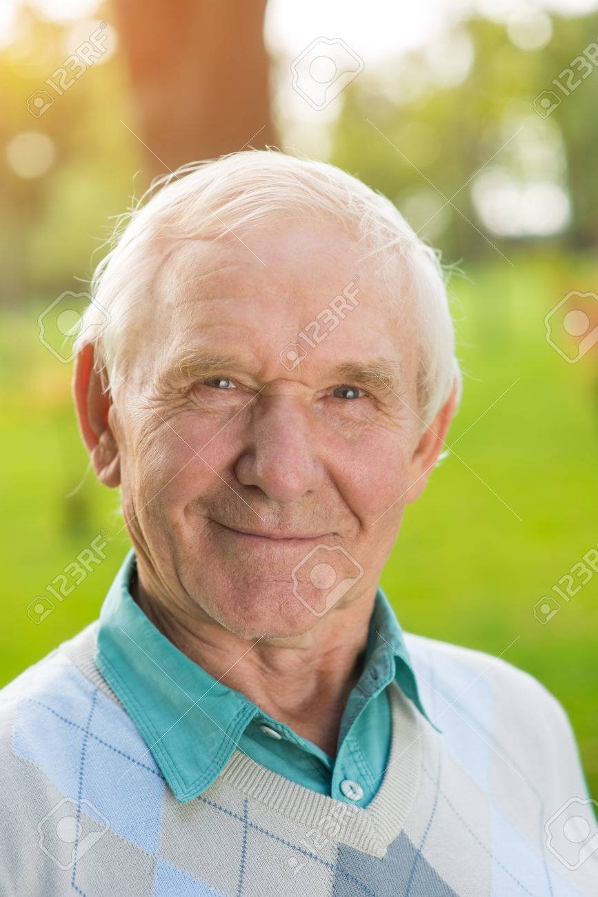 elderly man looking at camera.